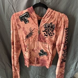 Pink hoodie. Nice black accent. Some gemstones and stud details